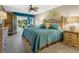 Spacious Primary bedroom with ceiling fan and access to private balcony at 5462 Chanteclaire # 65, Sarasota, FL 34235
