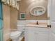 Clean bathroom includes a shower/tub combo, toilet, and vanity with a granite countertop at 5462 Chanteclaire # 65, Sarasota, FL 34235