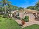 Single-story home with two-car garage and nicely landscaped yard at 5462 Chanteclaire # 65, Sarasota, FL 34235