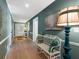 Elegant hallway with hardwood floors and soft blue walls at 5462 Chanteclaire # 65, Sarasota, FL 34235