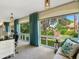Sunroom with wall-to-wall windows offering a view of the backyard at 5462 Chanteclaire # 65, Sarasota, FL 34235