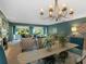 Open dining room with a chandelier and access to the living room at 5462 Chanteclaire # 65, Sarasota, FL 34235