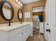 Updated bathroom with double vanity, walk-in shower, and neutral colors at 5462 Chanteclaire # 65, Sarasota, FL 34235