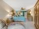 Bright Primary bedroom with a plush seating area and ample closet space at 5462 Chanteclaire # 65, Sarasota, FL 34235