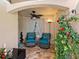Cozy front porch with seating area and lush greenery at 5462 Chanteclaire # 65, Sarasota, FL 34235