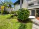Front view of condo with landscaped lawn and walkway at 1052 Longfellow Cir, Sarasota, FL 34243