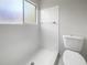 Clean bathroom with white tile shower and toilet at 1052 Longfellow Cir, Sarasota, FL 34243