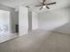 Spacious bedroom with ceiling fan and en-suite bathroom access at 1052 Longfellow Cir, Sarasota, FL 34243