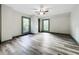Spacious bedroom featuring wood-look floors and large windows at 210 15Th E St, Bradenton, FL 34208