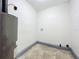 Laundry room with tile floor and space for washer/dryer at 210 15Th E St, Bradenton, FL 34208