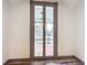 French doors opening onto a balcony, offering an outdoor view at 210 15Th E St, Bradenton, FL 34208