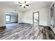 Open living room with wood-look flooring and access to stairs at 210 15Th E St, Bradenton, FL 34208