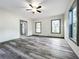 Bright living room featuring hardwood floors and large windows at 210 15Th E St, Bradenton, FL 34208