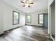 Well-lit bedroom with ceiling fan and double closets at 210 15Th E St, Bradenton, FL 34208
