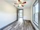 Cozy bedroom with wood-look floors and ceiling fan at 210 15Th E St, Bradenton, FL 34208