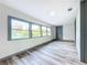 Bright hallway with wood-look floors and large windows at 210 15Th E St, Bradenton, FL 34208