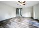 Bright bedroom with wood-look floors and ceiling fan at 210 15Th E St, Bradenton, FL 34208