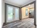 Dining area with wood-look floors and access to backyard at 210 15Th E St, Bradenton, FL 34208