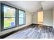 Living room featuring grey wood-look floors and backyard view at 210 15Th E St, Bradenton, FL 34208