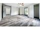Bedroom with wood-look floors, window, and closet at 210 15Th E St, Bradenton, FL 34208