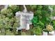 Property featuring a large backyard and mature trees at 210 15Th E St, Bradenton, FL 34208