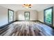 Spacious bedroom with wood-look floors and multiple windows at 210 15Th E St, Bradenton, FL 34208