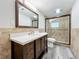 Modern bathroom with updated vanity and walk-in shower at 210 15Th E St, Bradenton, FL 34208