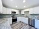 Updated kitchen with stainless steel appliances and granite countertops at 210 15Th E St, Bradenton, FL 34208