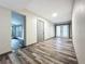 Bright hallway with wood-look flooring and access to other rooms at 210 15Th E St, Bradenton, FL 34208
