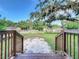 Wooden deck and stairs leading to backyard patio at 210 15Th E St, Bradenton, FL 34208