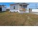 Charming single-story home with a welcoming front porch and landscaped yard at 1386 Ibis Dr, Englewood, FL 34224