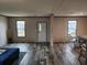 Inviting living room with ample natural light and stylish wood-look flooring at 1386 Ibis Dr, Englewood, FL 34224