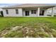Spacious backyard with a covered patio and ample green space, great for outdoor enjoyment and relaxation at 2302 123Rd E Pl, Parrish, FL 34219