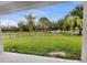 Scenic backyard view featuring a black metal fence and luscious grass at 2302 123Rd E Pl, Parrish, FL 34219