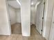 View of walk-in closet and tiled bathroom at 2302 123Rd E Pl, Parrish, FL 34219