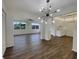 Open dining room with hardwood floors and chandelier at 8188 San Jacinto Ave, North Port, FL 34287