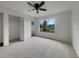 Bedroom with large window, ceiling fan and view of neighborhood at 8188 San Jacinto Ave, North Port, FL 34287