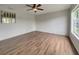 Spacious living room with hardwood floors and a ceiling fan at 8188 San Jacinto Ave, North Port, FL 34287