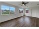 Living room featuring hardwood floors and multiple windows at 8188 San Jacinto Ave, North Port, FL 34287