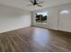 Living room with hardwood floors and large windows at 8188 San Jacinto Ave, North Port, FL 34287