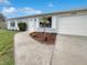 Front view of a single-story home with a two car garage at 8188 San Jacinto Ave, North Port, FL 34287