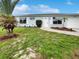 Newly renovated light blue single-story house with landscaped yard at 8188 San Jacinto Ave, North Port, FL 34287