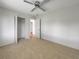 Bright bedroom with ceiling fan and spacious closet at 8188 San Jacinto Ave, North Port, FL 34287