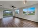 Bright living room with hardwood floors and sliding glass doors leading to backyard at 8188 San Jacinto Ave, North Port, FL 34287
