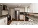 Updated kitchen featuring stainless steel appliances and granite countertops at 580 Leach St, Englewood, FL 34223