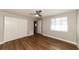 Well-lit bedroom with double closets and wood-look flooring at 580 Leach St, Englewood, FL 34223