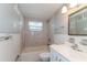 Clean bathroom with tub, shower, and vanity at 580 Leach St, Englewood, FL 34223
