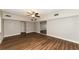 Large living room featuring wood-look flooring and a ceiling fan at 580 Leach St, Englewood, FL 34223