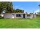 Charming single story home with a lush green lawn at 580 Leach St, Englewood, FL 34223