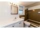 Clean bathroom with tiled shower/tub and updated vanity at 580 Leach St, Englewood, FL 34223